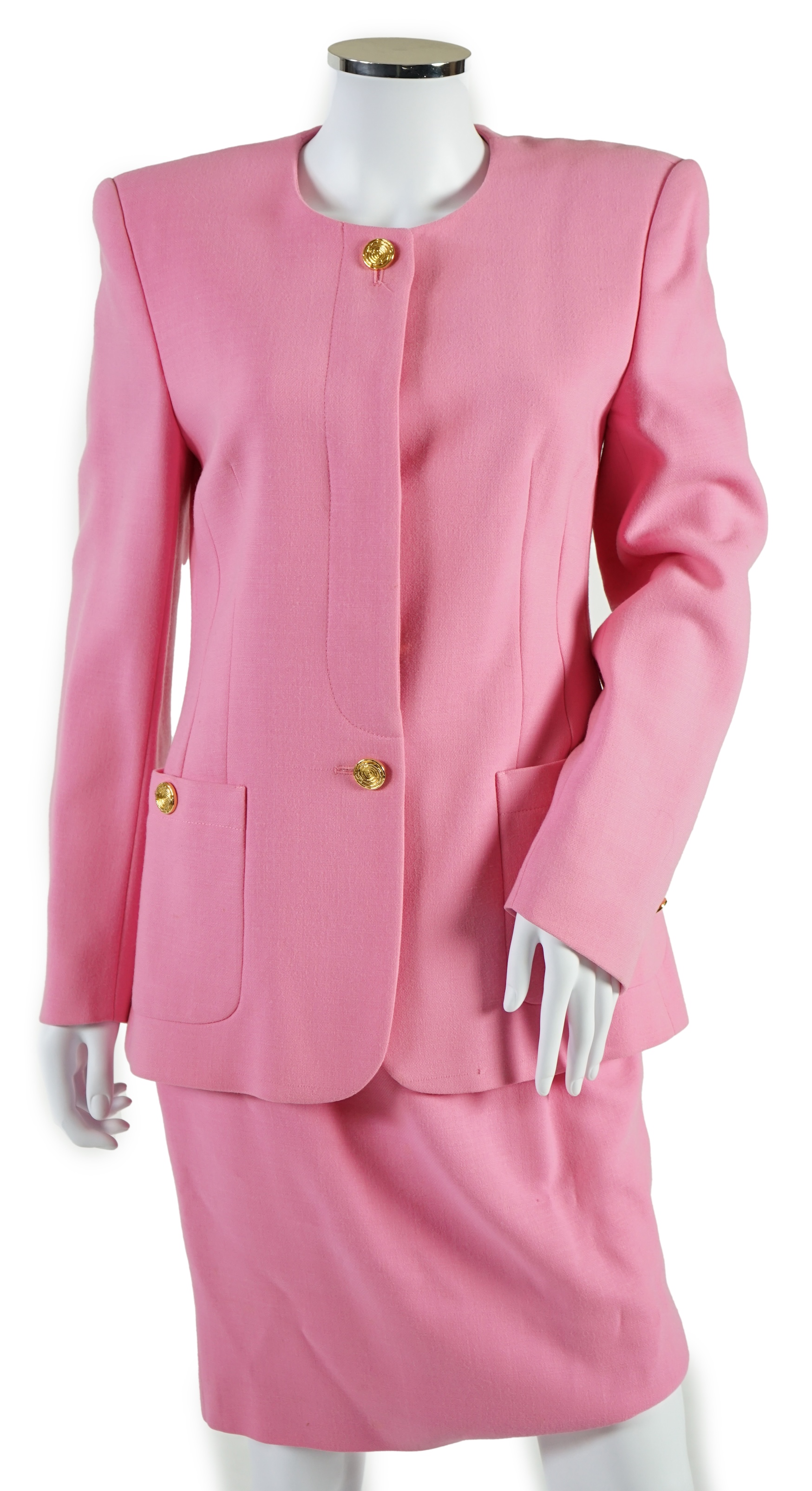 A pink Escada suit with a silk blouse top. Proceeds to Happy Paws Puppy Rescue